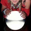 fortune teller over a blank crystal ball