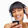 stockfresh_id57207_closeup-of-a-happy-young-girl-listening-to-music-on-headphones_sizeXS